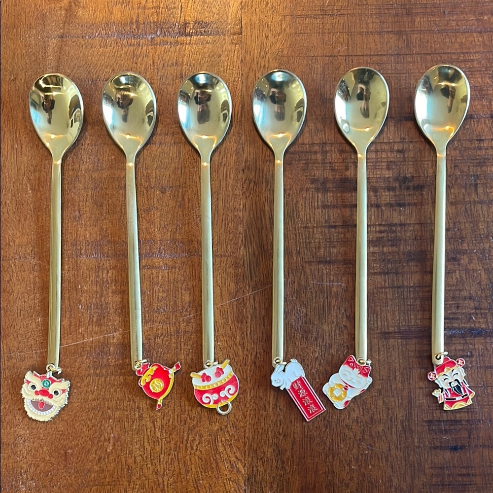 Set of Gold Spoons with Red and White Charms